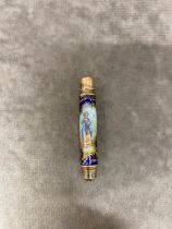 An antique propelling pencil with enamel design