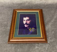 A framed signed photo of Freddie Mercury Frame size 27 x 32 cm