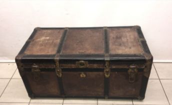 A vintage leather trunk with removable insert