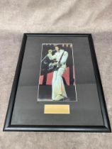 A framed autograph by Elvis Presley, the autograph is part of an old envelope. Frame size 33 x 43cm