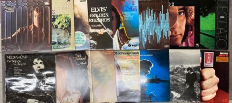 Vinyl collection of male artists including Neil Diamon, Johnny Cash and Don Mclean, all near Mint