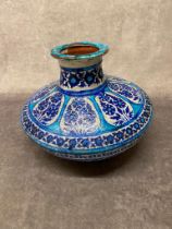 An antique Persian or possibly Turkish blue and white design vase 33cm wide x 25 high