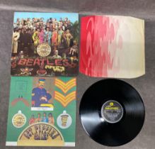 Sgt Pepper PMC 7027 Sleeve near mint, Vinyl near mint Mono 67 first pressing. KT Tax code stamp