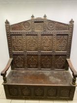 An antique oak settle 152 wide x 177cm high