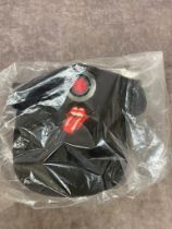 A Rolling Stones crew cap with built in head torch, still sealed in original bag