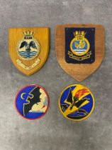 A group of 4 naval badges