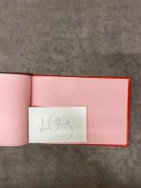 An autograph book full of sporting names including Will Carling, Gareth Chilcott, Nobby Stiles, Fred