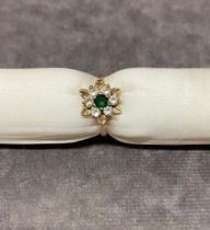 A 9 carat gold ladies ring set with Green Spinel size M, 3.2 grams