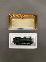 Mainline railways 00 Gauge class 57, 0-6-0 pannier tank in GWR green livery in boxed (bruised) and