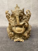 A carved wooden statue of Ganesh 35cm high