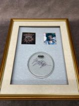 A framed singed drum head by Bob Dylan, Â£150-Â£200 Frame size 45cm x 55cm