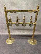 An antique brass optic set