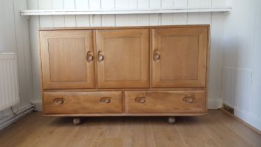 A mid century Ercol blonde Windsor side board