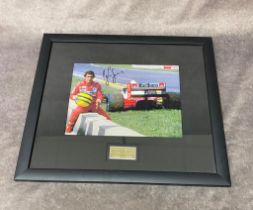 A framed signed photo of Ayrton Senna Frame size 35 x 39 cm