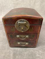 A vintage Chinese wooden box trimmed with leather