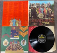 Beatles Sgt Pepper PMC 7027 Mono KT Tax code Side 1 cut through by spindle hole 67' pressing Fools