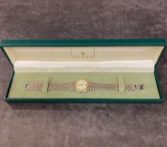 A ladies Gucci watch with stainless steel and gold coloured strap £30-£50
