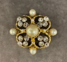 A vintage Chanel brooch set with diamanté stones and imitation pearls