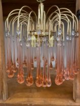 A mid century glass droplet light fitting