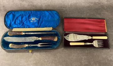 An antique silver plated carving set along with fish knife £15-£20