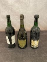 2 vintage bottles of port together with a 1973 bottle of Dom Perignon , a1970 Rebello Valente and