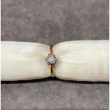 An 18 carat gold ladies ring set with illusion diamond, size i , 2.2 grams