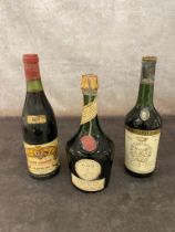 2 vintage bottles of wine along with a 1950’s bottle of Benedictine. A 1957 Gevrey-Chambertin, a