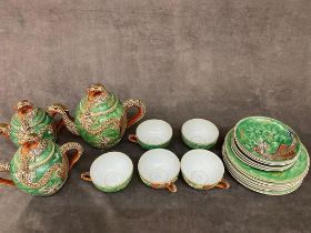 A vintage satsuma ware tea service ( one cup missing )