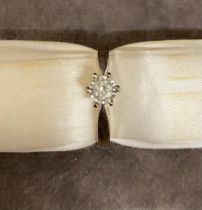 A 9 carat white gold ladies ring set with 0.3 carat diamond, size P.5, 3.86 grams
