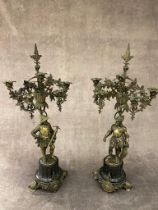 A very handsome pair of antique bronze candelabras, 73 cm tall