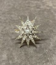 A Diamond Star Brooch