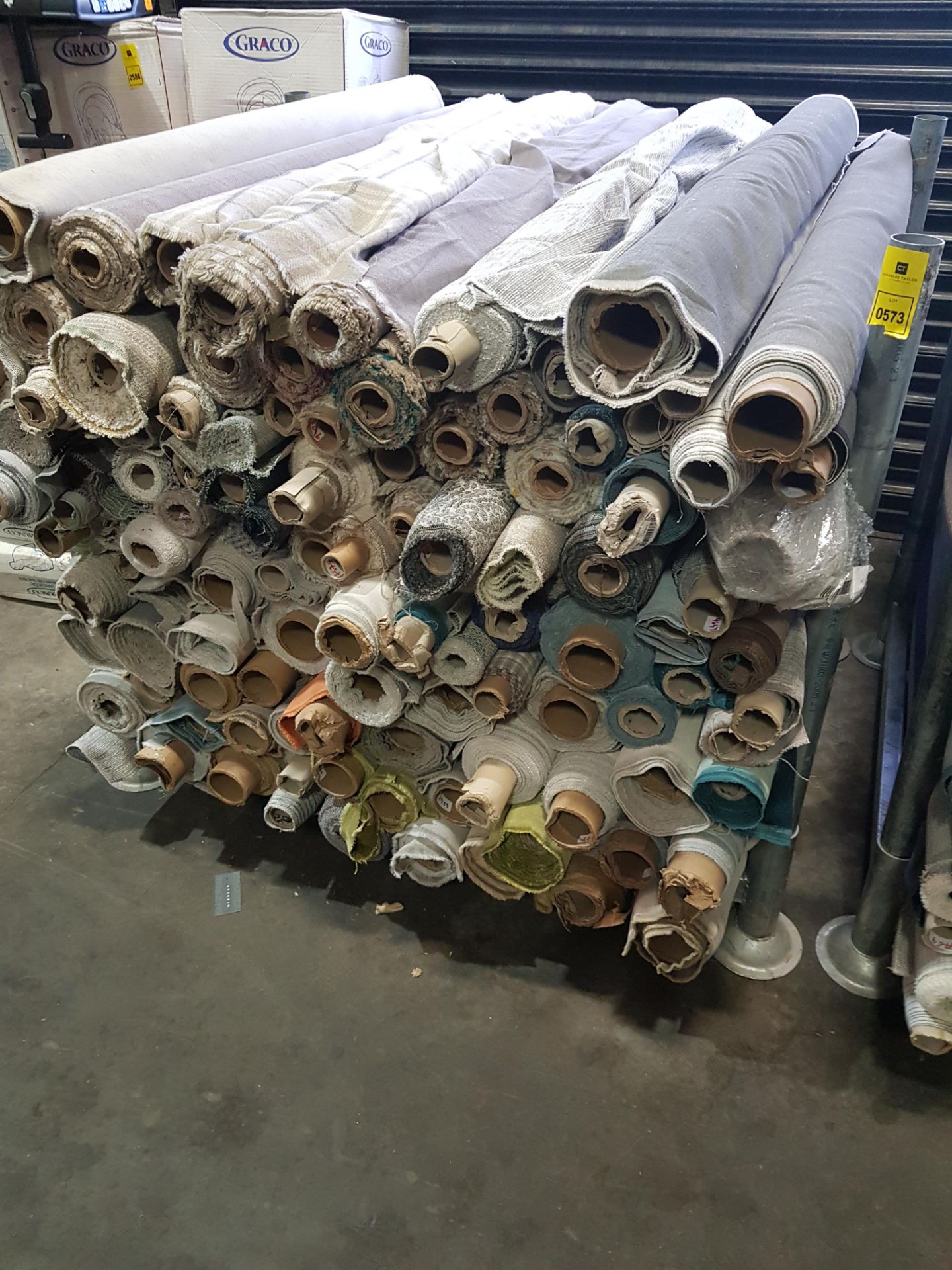 APPROX 120 X PART ROLLS OF FABRIC IN VARIOUS COLOURS AND STYLES (NOTE: STILLAGE NOT INCLUDED)