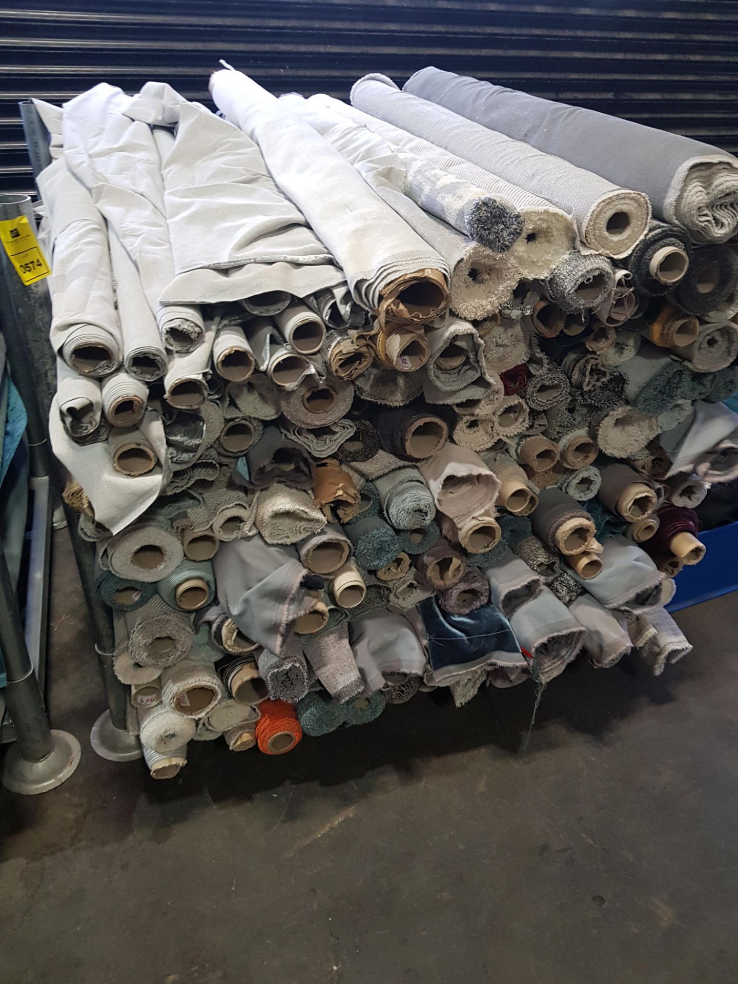 APPROX 120 X PART ROLLS OF FABRIC IN VARIOUS COLOURS AND STYLES (NOTE: STILLAGE NOT INCLUDED)