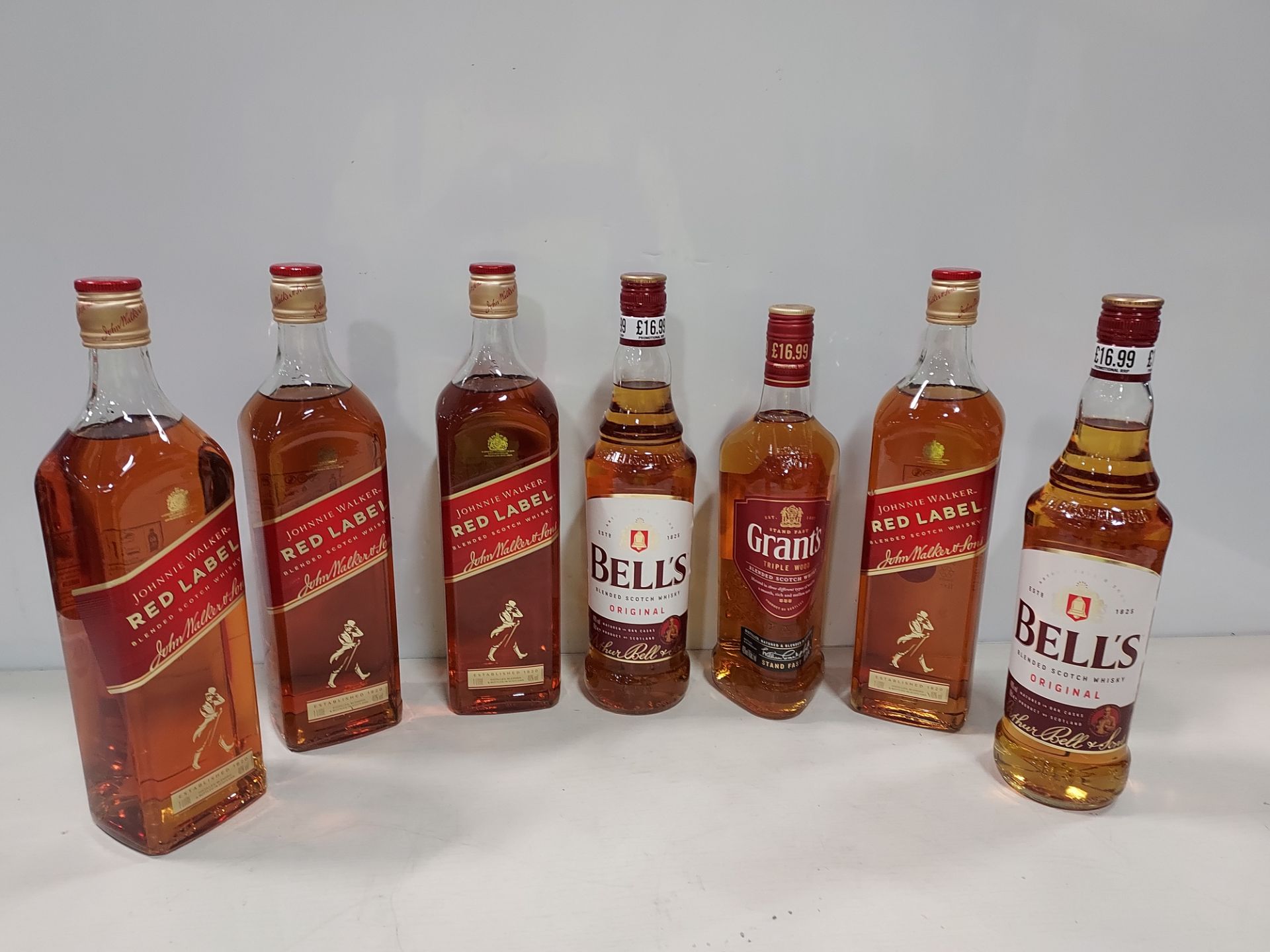 7 PIECE BRAND NEW MIXED ALCOHOL LOT CONTAINING 4 X 1L JOHNNIE WALKER RED LABEL WHISKEY - 2 X 1L
