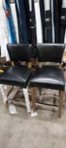 2 X BAR STOOLS IN BLACK LEATHER WITH WOOD BASE (PLEASE NOTE CUSTOMER RETURNS)