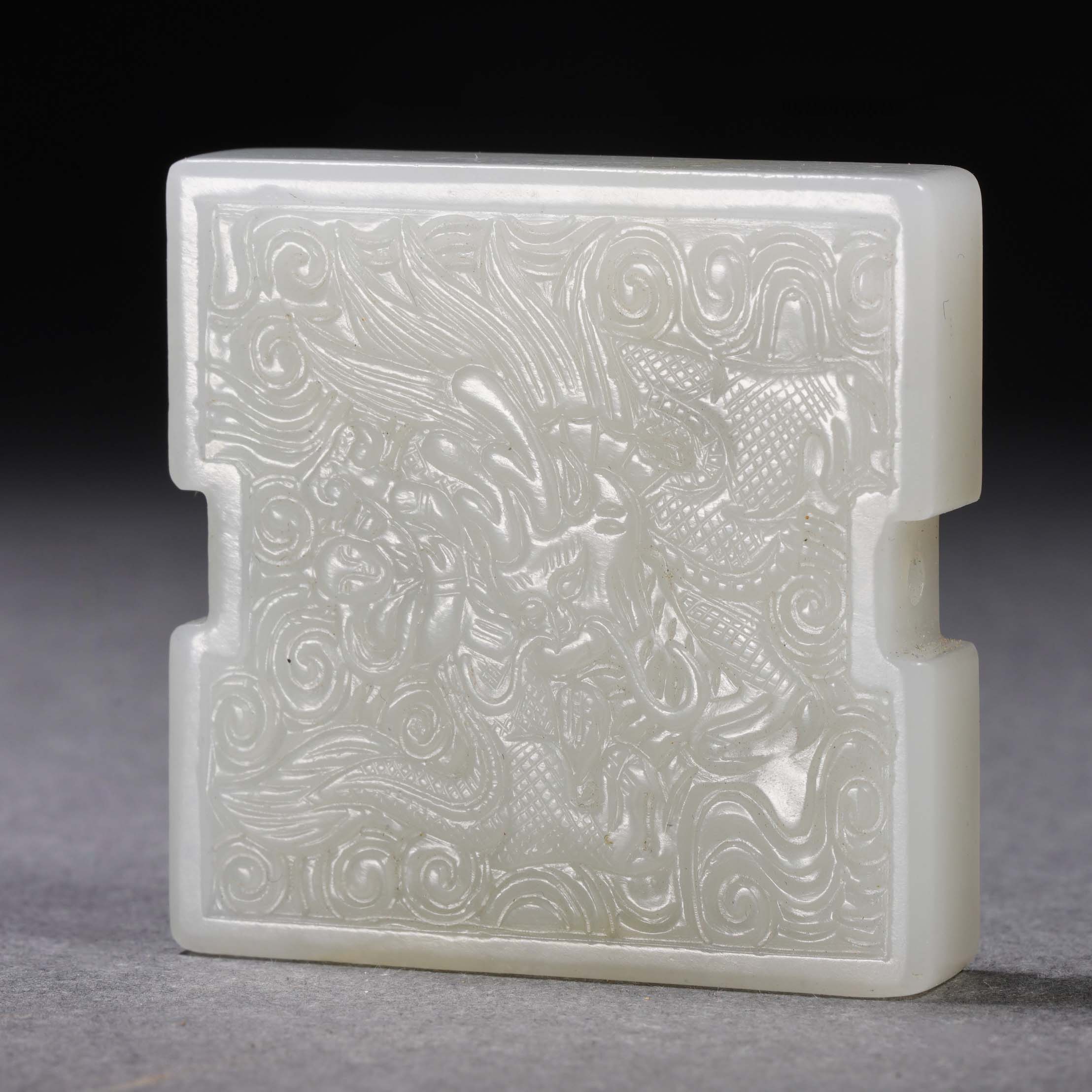 A Chinese Carved White Jade Dragon Plaque