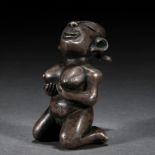 A Chinese Silver Kneeling Figure