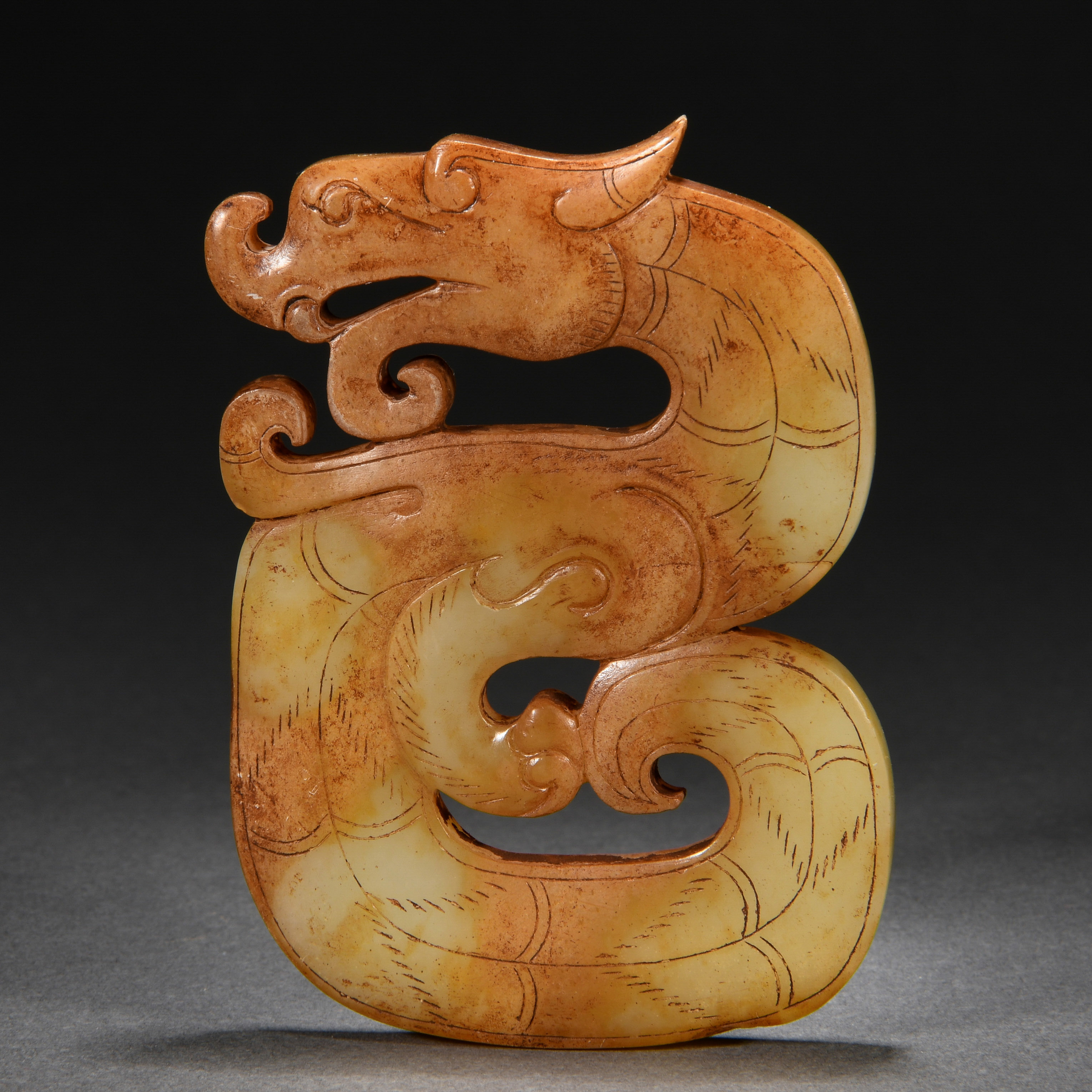 A Chinese Carved Jade Dragon Form Ornament