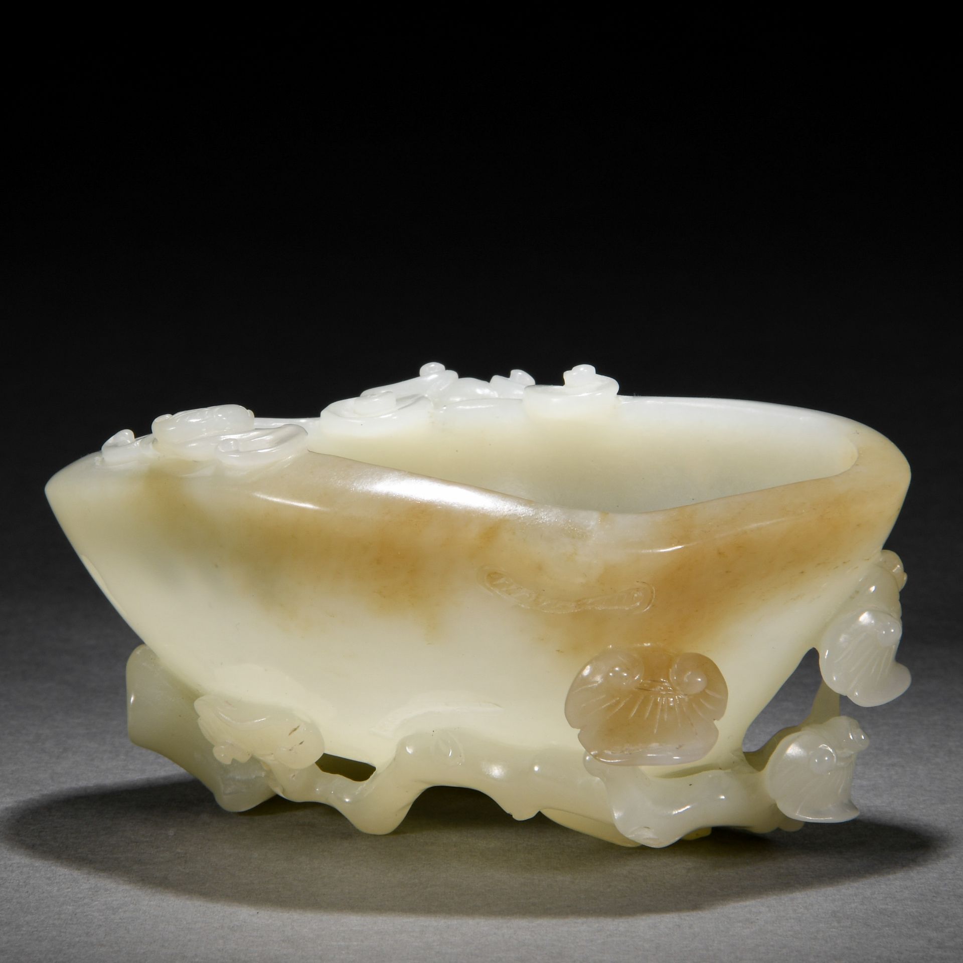 A Chinese Carved White Jade Washer