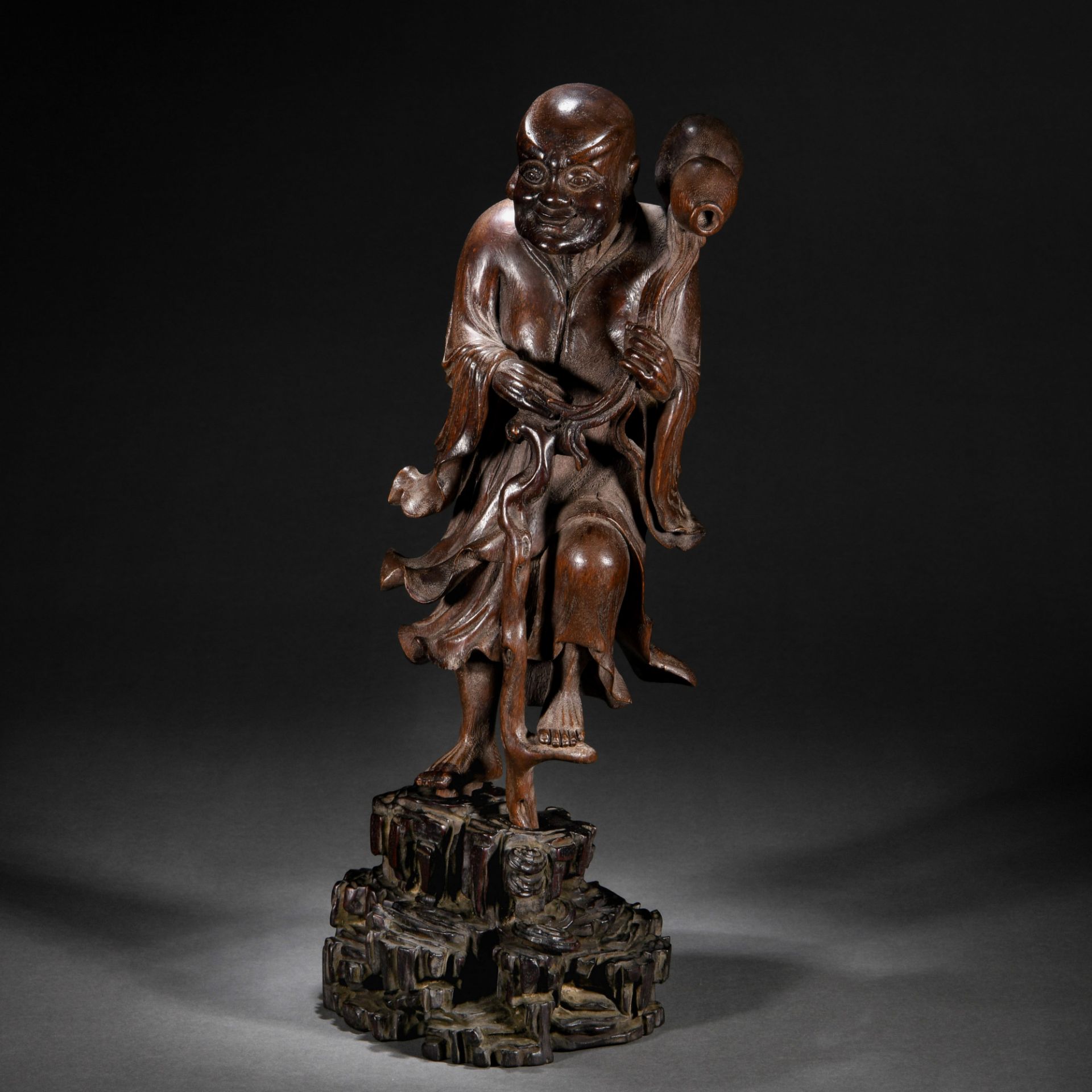 A Chinese Carved Rosewood Standing Figure