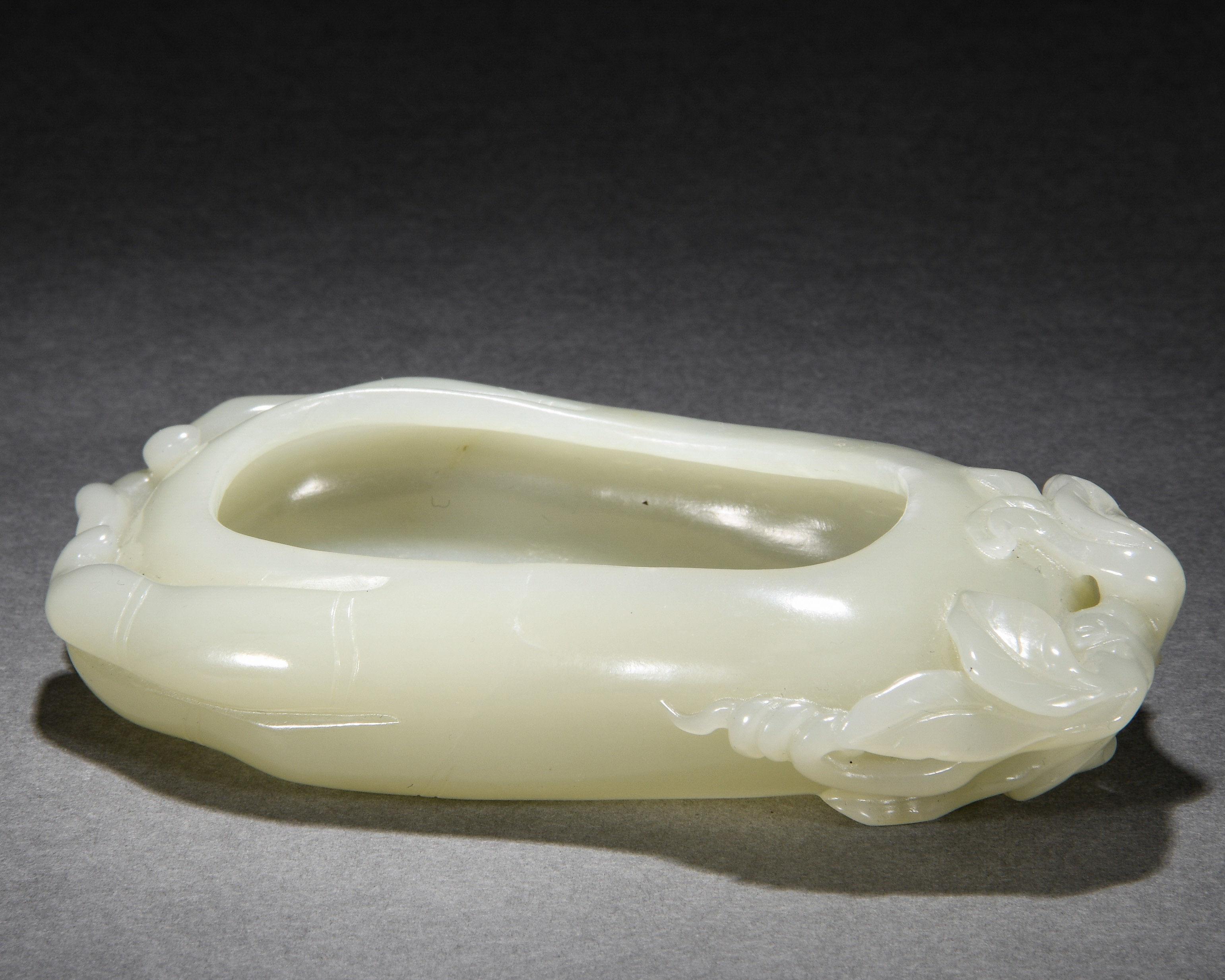 A Chinese Carved White Jade Washer