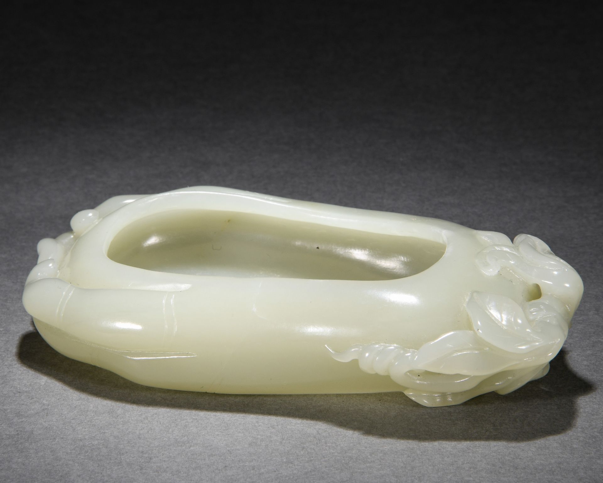 A Chinese Carved White Jade Washer