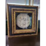 Alabaster medallion in ornate frame