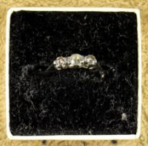 DIAMOND RING with 3 round cut diamonds (estimated 0.33ct) in white claw fitting, ring size J in