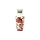 A CHINESE UNDERGLAZE-RED 'DRAGON' VASE 清十八或十九世紀 釉裏紅游龍戲水紋瓶