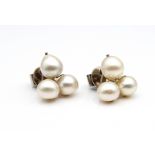 1 pair of eye-catching stud earrings with cultured pearl