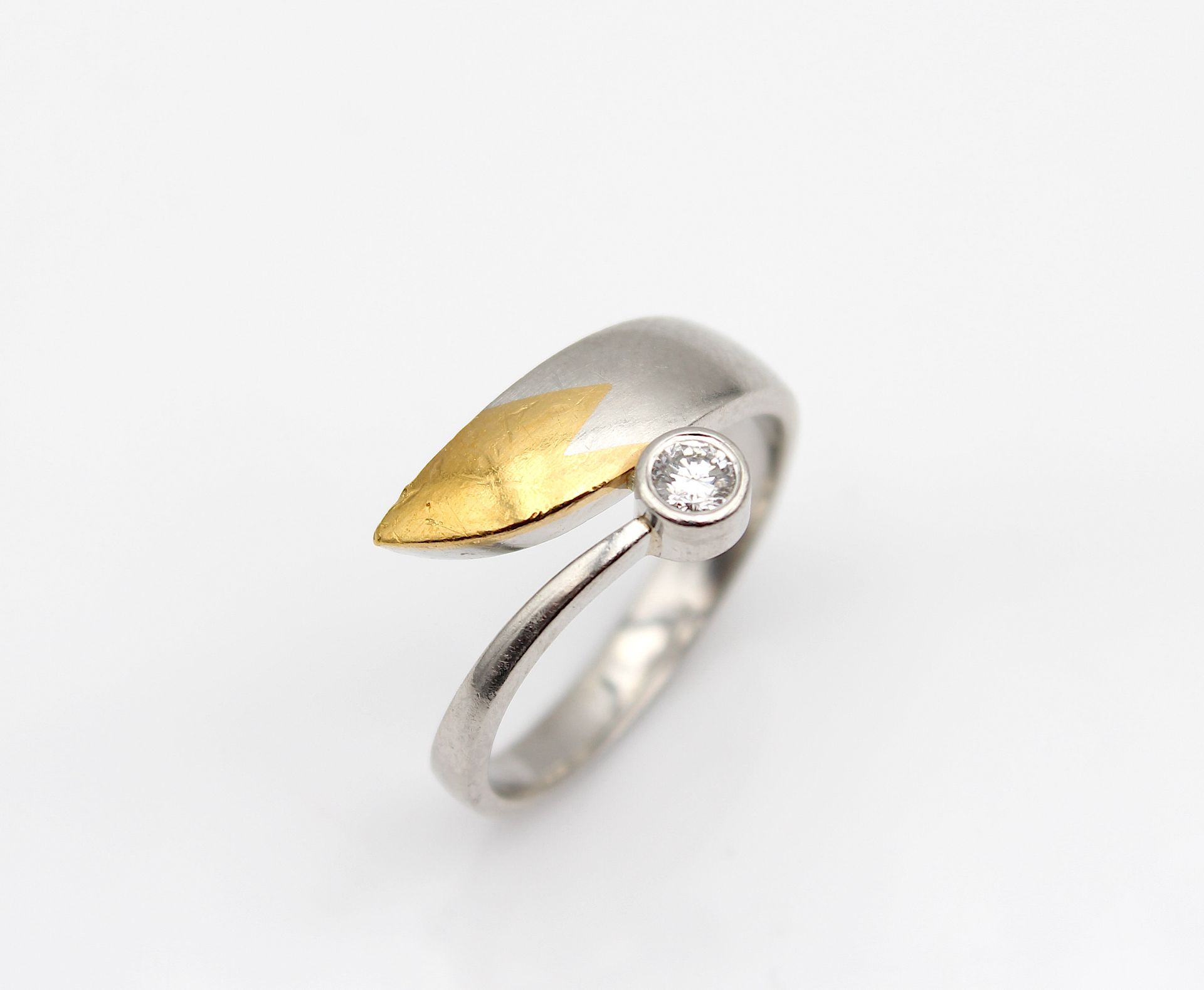 Modern platinum ring with brilliant