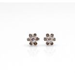 Pair of delicate stud earrings with diamond