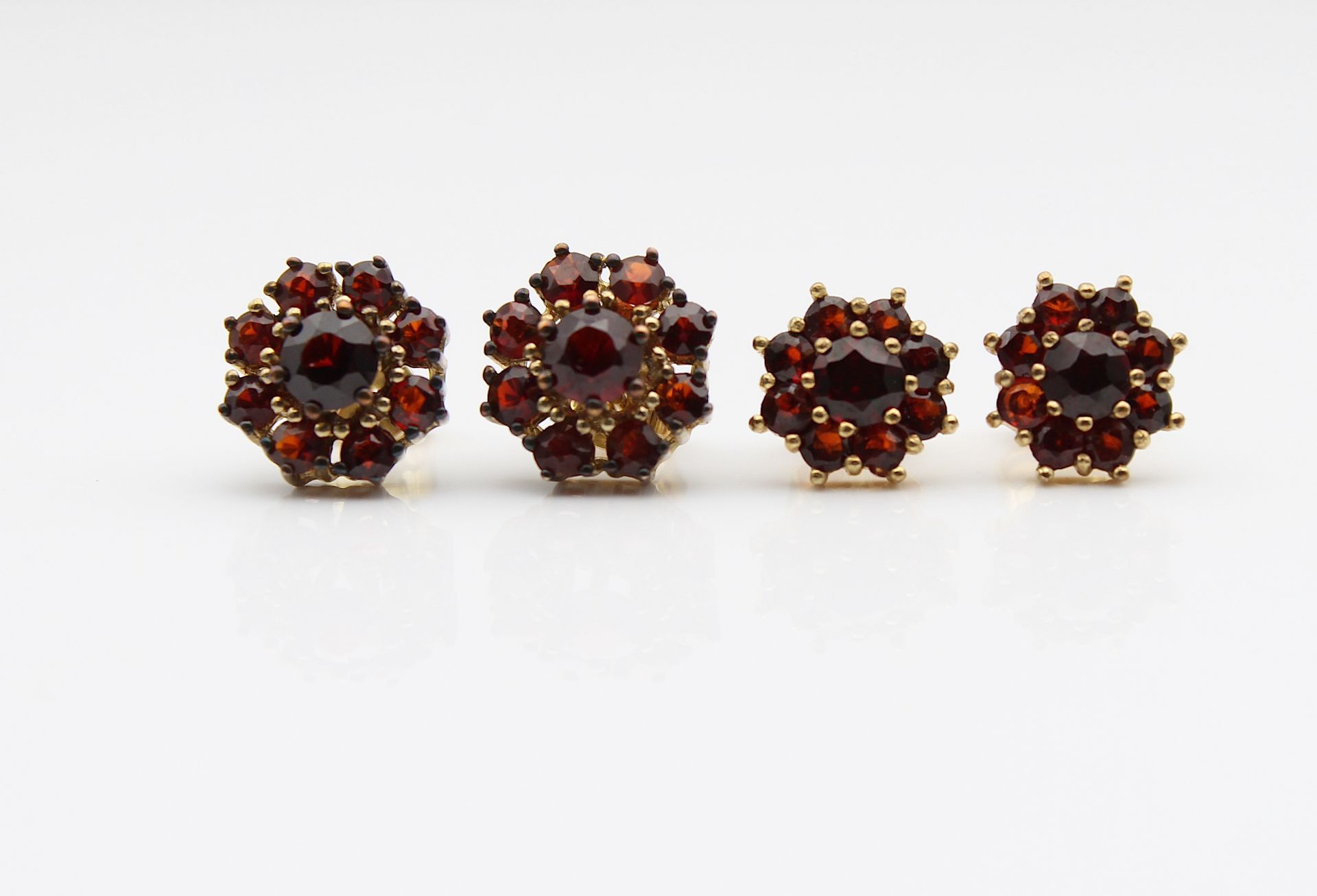 2 pairs of stud earrings with garnets