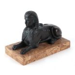 A bronze figure in the form of a Sphynx mounted on a stone veneered plinth, 19.5cms long.